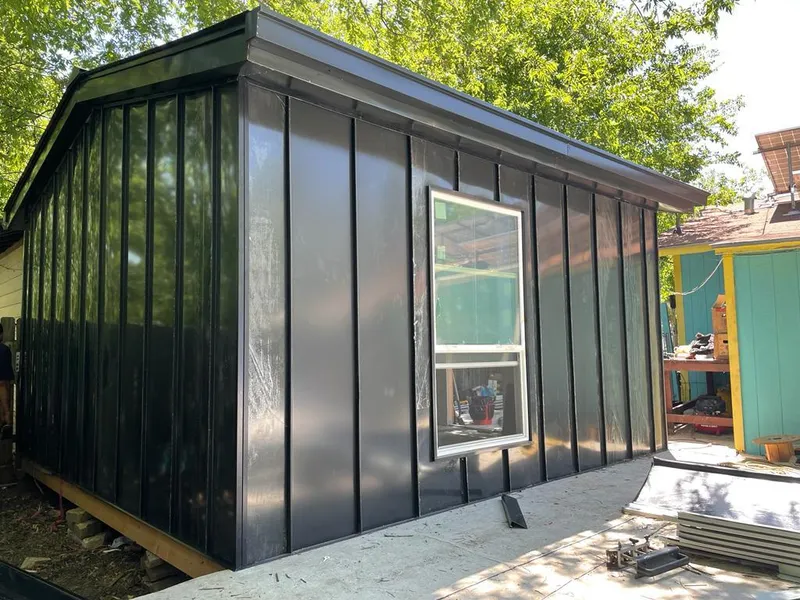 Black standing seam metal wall panels for Roof Inspection in Tupelo