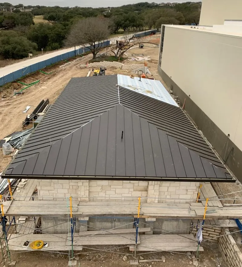 Metal roof new construction with scaffolding in Tupelo